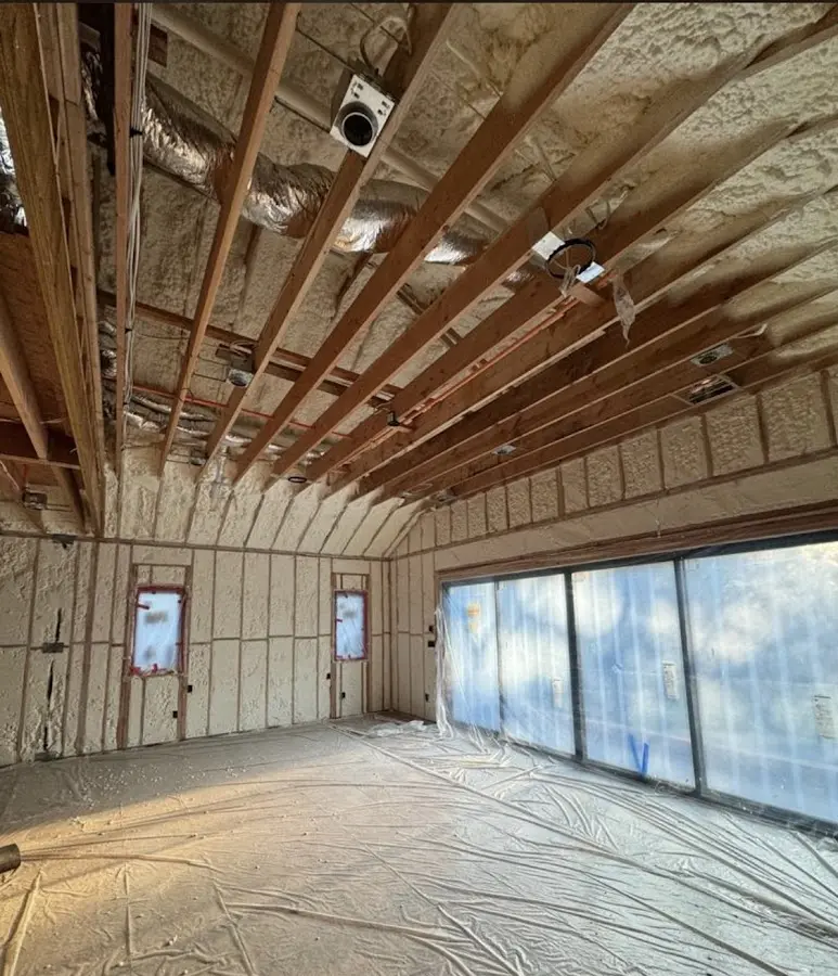 Interior walls and ceiling insulated with spray foam during new construction in Suwanee